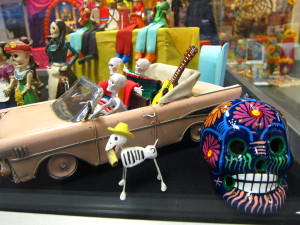 Curio cabinet vignette from the Day of the Dead exhibit at the Dr. Martin Luther King Jr. Library. The Day of the Dead celebration extends from Nov. 1 to Nov. 2.