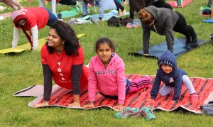 High housing cost, limited child care and a public school system with a mixed reputation have reduced births and birth rates in San Francisco. That has changed in the last five years. In June 2015, at International Yoga Day at Marina Green Park. (Photo by Jesus Nava Jr.)